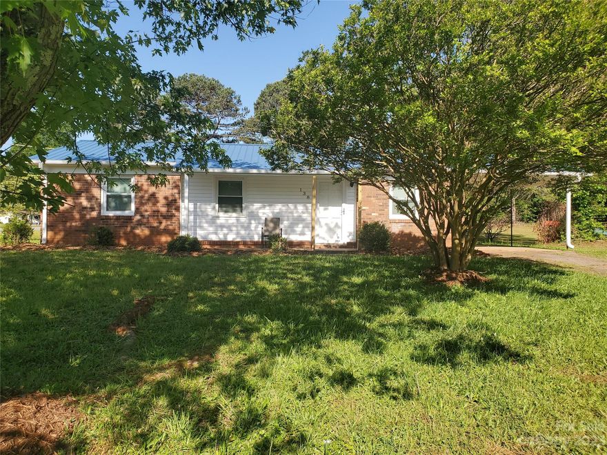 Adorable full brick home on a .34 acre corner lot, perfect for an investment property or a primary home. This 4 bedroom, 2 bath home has had several updates. Updates include new Heat Pump in Fall 2022, New stove, microwave and refrigerator, new vinyl plank flooring, freshly painted, new lights throughout home and new bathroom cabinets and toilets in both baths. Roof is 9 years old per seller. 1 car carport. Large outbuilding in back yard. Amazing location, convenient to shopping, restaurants, quaint downtown Troutman and I-77.