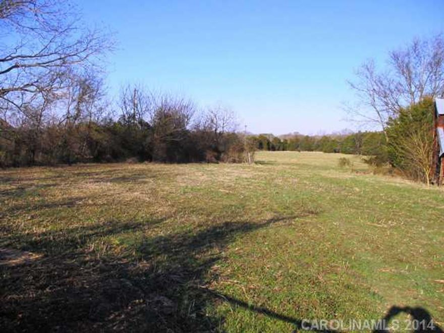 Nice flat pasture land in a good location. Old barn needing some TLC on the property. Old house is not part of the property. Some fencing exists, but needs repair. Good possibilities for a small farm.