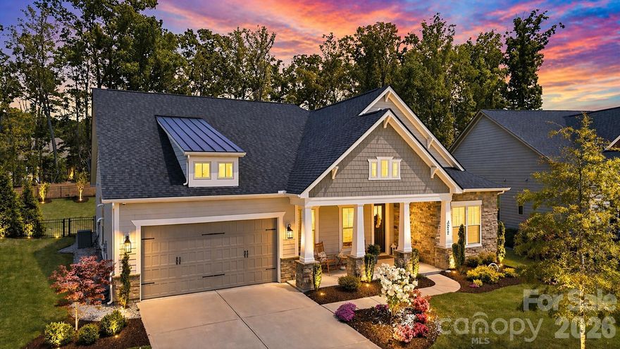 This beautifully maintained single-story home offers a refined blend of modern comfort and elevated living in a sought-after, newer community. This move-in-ready residence features 8 foot doors, 10 foot ceilings and an open-concept layout filled with abundant natural light, creating a bright and inviting atmosphere throughout. 

The spacious kitchen flows seamlessly into the living and dining areas, making it ideal for both everyday living and effortless entertaining. Expansive sliding glass doors extend the living space outdoors to a covered patio and a thoughtfully designed backyard. Surrounded by mature foliage, the private wooded backdrop offers a rare sense of tranquility with protected green space behind the home. A fire pit creates the perfect setting for relaxing evenings or gathering with guests.

The well-proportioned bedrooms provide comfort and privacy, while the single-story design enhances convenience and livability. This home includes custom designed closets in primary bedroom and pantry. The garage features durable epoxy-coated flooring, adding both function and a clean, polished finish while the outside patio/lanai includes a polyaspartic floor coating.

Residents enjoy access to exceptional community amenities including a pool, clubhouse, playground, dog park, and scenic walking trails. Ideally located just minutes from Carolina Commons, this home also offers convenient access to Ballantyne (approx. 10–15 minutes), Uptown Charlotte (approx. 25–30 minutes), and Charlotte Douglas International Airport (approx. 30–35 minutes), making it perfectly positioned for both daily living and commuting.

Blending indoor comfort with outdoor tranquility, this home delivers style, privacy, and everyday ease in a prime location.