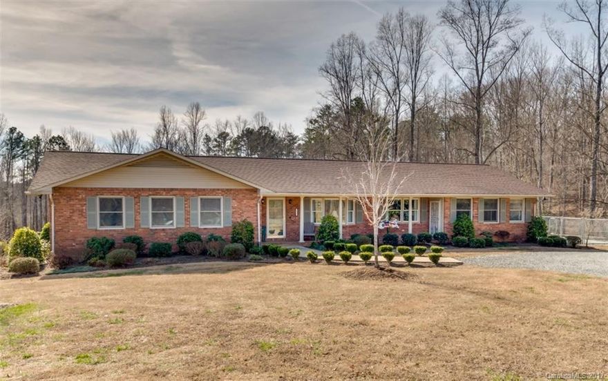 Think Mill Pond Farm, a pristine mini farm in the middle of horse country. Perfect for an equestrian or hobby farm, this home features one level living on the main floor, 3BR/2 with 2-car garage, plus separate 1 bedroom, 1.5 bathroom with 1-car garage on the lower level. The outdoor features include a 2+ stall barn with 2 paddocks and additional building for hay storage, a pond, creek frontage, rose garden, & blueberry bushes. Close to shopping. 10 min to Tryon International Equestrian Center.