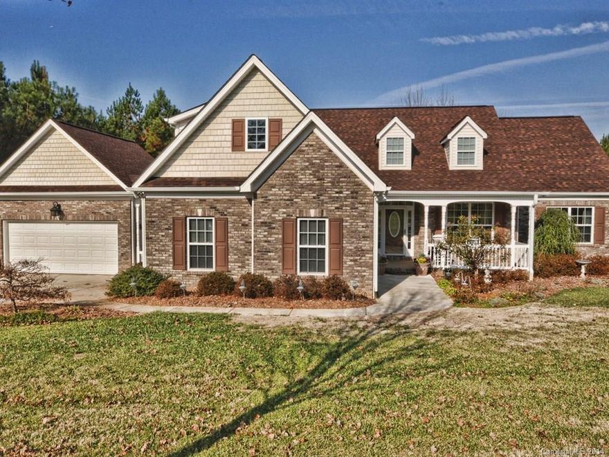 Beautiful neutral décor & exceptionally maintained on over 1 acre. Open flr plan w/ REAL oak HW floors. Kitchen w/ granite tops, cherry cabinets, tile backsplash, stainless appliances. Vaulted great room w/ gas fireplace. 3 bed/2 bath all on main floor. MBR w/ tray ceiling. Studio/office & sun room on main & bonus on 2nd. Air conditioned detached garage. Entire yard landscaped with irrigation sys, lighting, drip lines. Fenced area, stone sidewalks, storage shed. Private, Easy Charlotte commute!