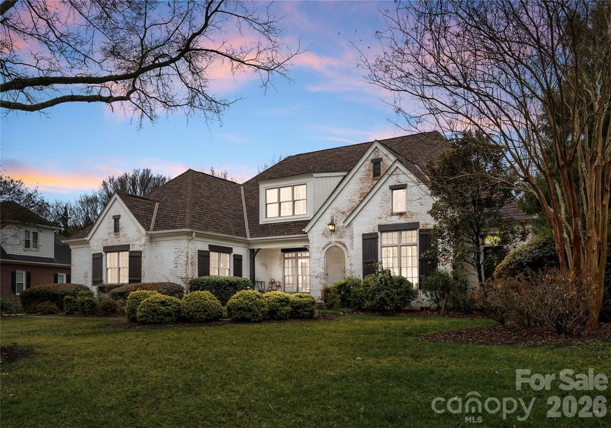 Welcome to 814 Kings Crossing Dr NW, a beautifully designed custom built home offering timeless style, spacious living, and exceptional indoor-outdoor entertaining. This impressive residence features 5 bedrooms, 4 bathrooms,  a dedicated office, 3-car garage, and almost 4,100 square feet of living space on a beautiful mature lot. 
From the moment you arrive, the charming lime washed brick exterior gives a refreshed cottage-inspired esthetic; the brand new architectural roof, manicured landscaping, and inviting covered front porch all create such charming curb appeal. Inside, a welcoming foyer with rich wide plank hardwood floors, detailed millwork, and a grand staircase sets the tone for the home’s elegant interior.
The thoughtfully designed main level offers multiple gathering spaces including a formal living room with coffered ceilings, fireplace, and large windows with plantation shutters that flood the room with natural light. The chef’s kitchen is the centerpiece of the home, featuring custom cabinetry, expansive countertops, a large center island, professional-grade gas range with pot filler, large walk-in pantry, and an open layout that flows seamlessly into the breakfast area and keeping room.
The spacious primary suite on the main level provides a luxurious retreat with serene views and a spa-inspired bath showcasing exquisite tile, a freestanding soaking tub, oversized glass shower, heated floors, dual vanities, and a walk-in closet/dressing room. All 4 secondary bedrooms are large in size and the 4th would make a perfect bonus room space if desired. 
Step outside to your private backyard oasis, complete with a stunning in-ground saltwater pool with tanning ledge, expansive paver patio, turf grass, and covered outdoor living space with pergola—perfect for entertaining or relaxing year-round. 
Located next to the desirable Cannon School with convenient access to shopping, dining, parks, and highways I-85 & I-485, this home offers the perfect blend of elegance, comfort, and resort-style living. This is the one you have been waiting for, welcome home!