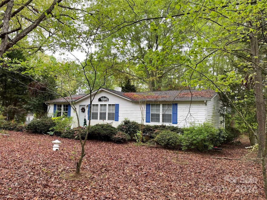 Make this manufactured house and lot a home, with your own update ideas.  It features a split floor plan with primary bedroom/bathroom, two other bedrooms, with easy access to the full hall bathroom, living room with FP and kitchen/dining area. There is a rear covered porch and a detached two car garage with loft space. Some areas are not accessible due to potential safety hazards which includes the loft space above the two car garage.  Viewings are subject to a property disclosure with attachment being signed and provided to the listing broker before viewing.