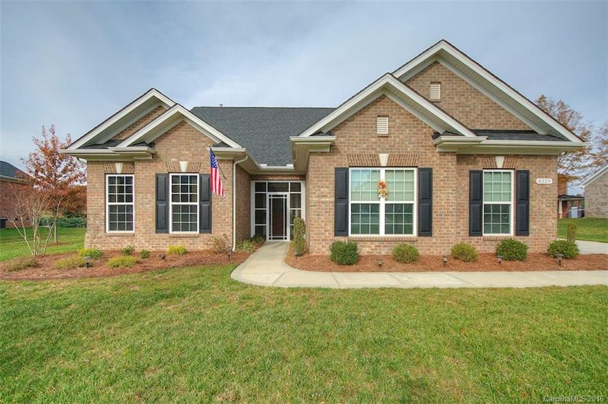 Stunning 3BR/2BA full brick ranch, .43 acres - Olde Stonegate of Mint Hill! Sought after area close to shopping, dining & Interstate travel. Exterior living areas include in-ground heated salt water pool with connected waterfall hot tub, stone outdoor fireplace, extended patio with pergola and built in grill. Spacious open floor plan with cathedral ceilings, architectural detail, granite, eat in bar, stainless steel, hardwoods, fireplace. Master retreat features double sink, large stone shower.