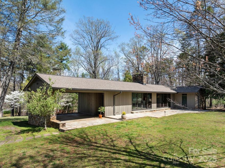 Simply and distinctively delightful, this one-of-a-kind equestrian property features a custom built mid-century home, conveniently located in the heart of Tryon's coveted Hunting Country neighborhood and directly on the FETA trail system. The 3BR/2.5BA is well-sited on the picturesque 18-acre parcel, affording both privacy and beautiful mountain views. The interior design lends itself to one-floor living, with additional living areas in the lower level, if necessary. Extensive recent updates include full kitchen remodel, remarkable master bedroom suite addition, bathrooms, HVAC, tankless water htr, plumbing, automatic generator and more. Wood floors and paneled walls, large picture windows for light and views. Stone patios, terraces, and rolling pastures around the home. Equestrian amenities include a 4-stall center-aisle barn w/wash stall and tack room, 2 fenced paddocks, and 1 large fenced pasture. FETA trail on property leads to miles of riding enjoyment. A truly unique opportunity.