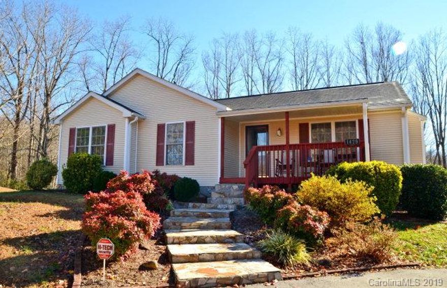 Fantastic home outside of Old Fort City limits.  This 3 bedroom, 2 bath home boasts of privacy on the 2.08 acre lot. Throughout the home you'll find lovely hardwood flooring in the living room, kitchen, 1 bedroom and hallway. There are beautiful tile floors in both bathrooms. Carpet in 2 of the bedrooms. A large and Expansive deck is located directly off of dine-in Kitchen. Living room has nice fireplace with gas logs for cozy winter evenings. Enjoy the extra large windows that provide an overabundance of light and easy access for the beautiful winter views of Mount Mitchell. Many hours of year-round enjoyment to be had from the covered front porch. Full basement with extra storage and additional room to grow if any extra square footage is needed for your family. You'll want to make an appointment to view this home ASAP!