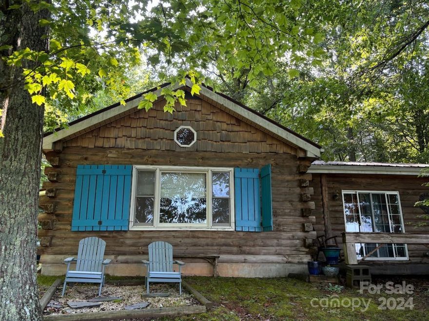 Comfortable cozy log cabin with an awesome view. Spacious outdoor deck with swing and wood stove perfect for fall and winter evenings. Very private but close to the town of Bakersville. Lovely great room with vaulted ceiling, and propane standalone fireplace. Long range views of distant mountains.1.2 acre of partially wooded land with a few restrictions. Private septic tank and shared well. Perfect Mountain getaway or year-round cabin.