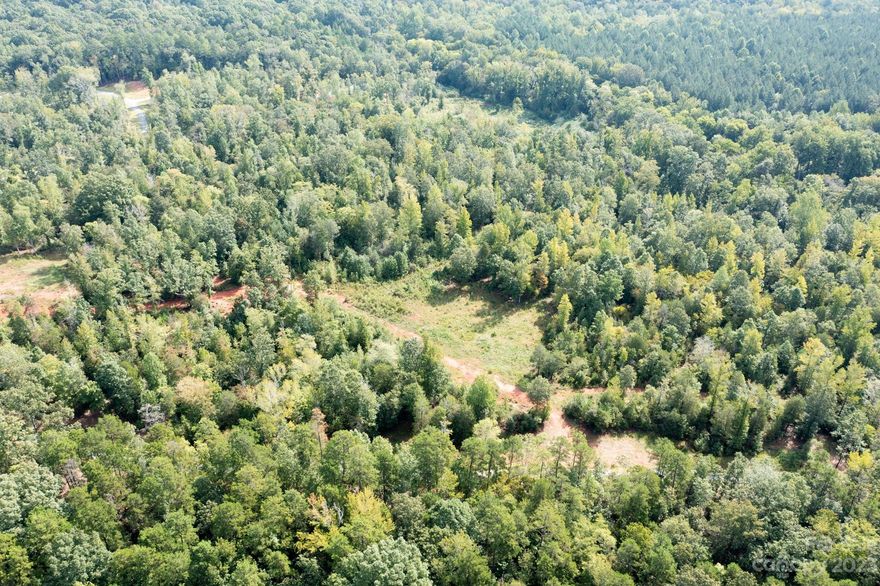 Looking for privacy; where you can bring your own builder? This large over 12 acre parcel located in the small established six lot community of Settlers Creek; only a short 10 min drive to Historic Downtown Waxhaw! The lot features already a large cleared area for your next custom home. Primarily level overall lot; as well as at the proposed building site. However you will appreciate the gradual slope down to the small stream/creak at the back of the property.