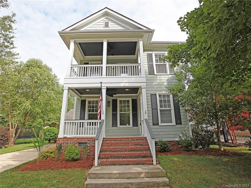 This is the only one that you'll have to see! Immaculate from the double porches to the oversized rear 2 car garage. Traditional site finished hardwood floors downstairs. Formal dining large enough to fit a spacious dining table and accessories. Renovated Master Bath. Full irrigation. Incredible location!! Walk to Town Center restaurants, shops, and Pools. Large green space in front.