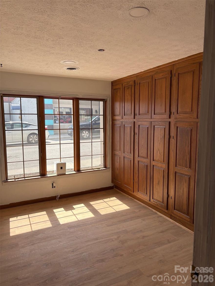 Completely renovated office space featuring 7 individual office spaces and a lobby/reception area. Full kitchen and restroom on site as well. Unfinished basement area, approx 700 sqft, can be used for storage, or finished for additional office use. Excellent location in downtown Hendersonville!