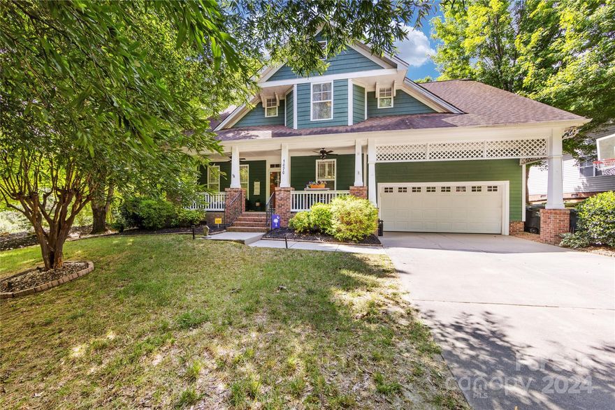 Beautiful Tega Cay, Saussy Burbank built Home in the popular Lakeshore section.  Situated beside a large greenspace lot where no other home can be built & backs to a wonderful wooded view to give you a resort/mountain feel.  Walk to Tega Cay Elementary on the walking trail outside your front door.  Great outdoor living spaces includes a large covered front porch, 2 side fenced areas offering patio/sitting areas, back deck & mature, professional landscaping. Back & side areas are totally fenced. Great floorplan w/Primary Bedroom Suite on Main, nice private office w/french doors, Formal Dining Room & Kitchen opening to a breakfast area & 2 story Great Room.  Wonderful 11.5x18 Sunroom offers a nice flex space to overlook the private backyard w/wooded views.  Upstairs offers you tons of walk in Attic Storage.  There is also a huge 15x28 Bedroom/Bonus Room for so many different uses. The gorgeous Solid Hardwood Floors throughout the entire home is the icing on the cake. Don't miss this one!