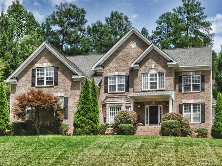 Spacious full brick home in great community on Mountain Island Lake with pool, lake access, tennis courts and walking trails.  Fenced back yard, tons of storage.  Guest suite on main level.  Master, three additional bedrooms and large bonus room up.  Stainless appliances and bar with wine cooler. Nice laundry room and huge pantry.  Central vac. Many updates.  A lovely home!