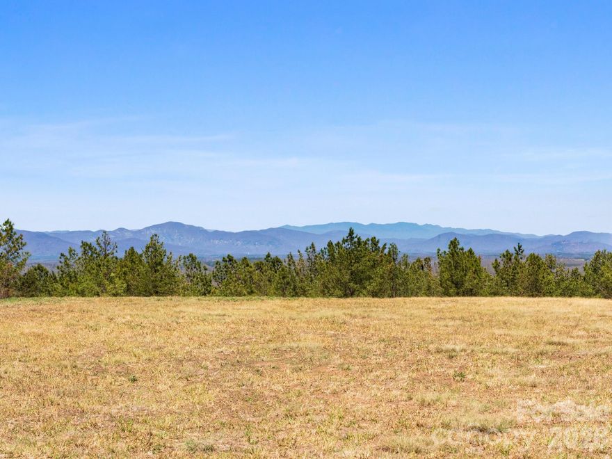 Private, exclusive "one-of-a-kind" parcel with stunning mountain views awaits your new home build. This remarkable 12+ acre parcel offers several possibilities all in a very private setting tucked away at the end of a cul-de-sac.  Build-ready, a level building site has been created along with a rough driveway in. The views are spectacular; a true must see.  And there are opportunities for more with additional clearing. Well-suited for a private country residence or second getaway home. There is also equestrian potential if limited paddock/grass areas are required. Room for a small barn, run-in shed, and/or paddock area(s) with additional clearing potential on the lower end of the parcel. Direct FETA trail access from the property, not too far from where FETA and CETA trails intersect. Access to the parcel is provided via easement through a gated community, offering security without the covenants and restrictions of the HOA.  A true rare opportunity. Showing by appointment only.