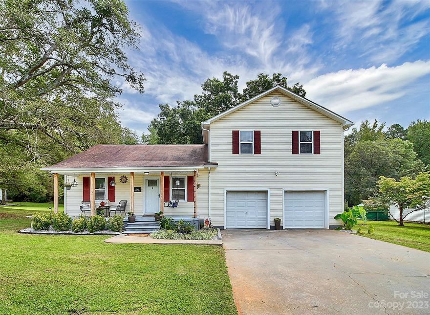 Welcome to 411 Faulkner Street! This 3BR 2BA home is located just minutes from dining and shopping in the heart of historic Clover, SC! You will love that this home features an open and spacious fenced-in backyard and has NO HOA! Enjoy quiet evenings on your covered front porch, back deck, or from the convenience of your own balcony attached to the primary bedroom suite upstairs. New LVP flooring throughout a majority of the home, and fresh interior paint from 2023. HVAC serviced Sept 2023 - info attached! Plenty of additional storage in the 2-car garage and in the wired outbuilding in the backyard.