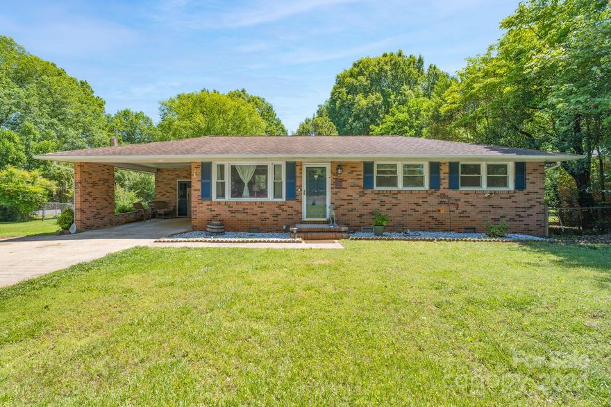 This super convenient full brick home is just minutes away from downtown Rock Hill, Winthrop University, I-77 and more!  Walk across the street to Cherry Park, or enjoy easy living on the large 18'x33' back paver patio with 220 amp already pre-wired for a hot tub.  A new HVAC unit was installed in February 2024, and never worry about running out of hot water with the tankless water heater.  Come view this home today!