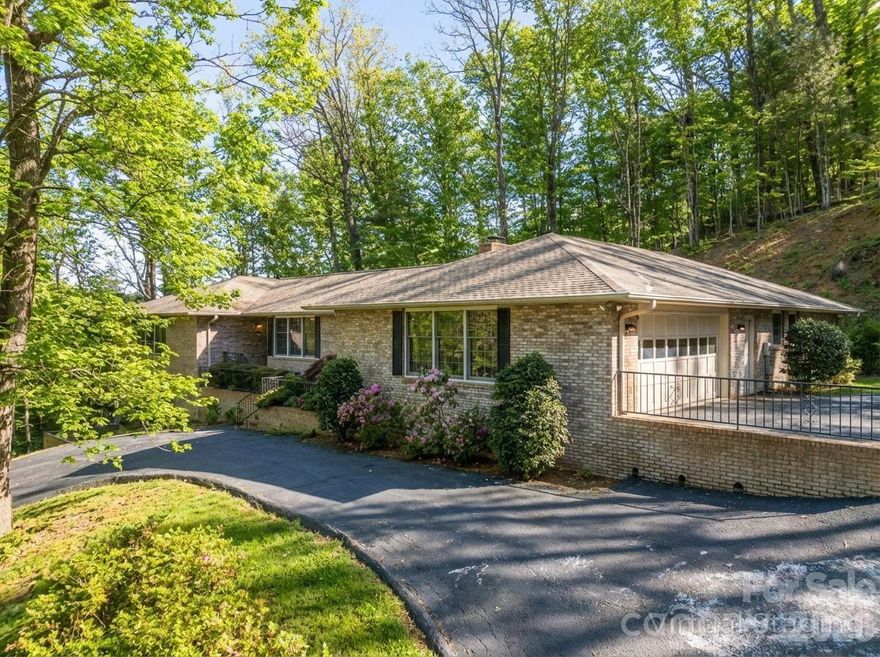 PRICE IMPROVEMENT! - Wake up to beautiful mountain vistas from this solid brick home in Claremont, a well-established and highly regarded community in historic Flat Rock, NC. This sprawling ranch offers all the essentials for comfortable main-level living, featuring three generously sized bedrooms and three full bathrooms thoughtfully positioned at each end of the home—ideal for privacy and for hosting guests.
The front entrance welcomes you with a proper entry foyer into the main level, which includes a formal dining room, den & office, a breakfast nook, gourmet kitchen open to the great room, a dedicated laundry room, and a screened three-season sunroom. Natural light fills the open floor plan, streaming into the kitchen in the morning and highlighting the vaulted-ceiling great room in the afternoon.
The gourmet kitchen is a chef’s dream, showcasing a 6-burner Jenn-Air gas range, an abundance of quartz-topped counter space in a neutral palette, and exceptional storage with a large pantry, plentiful cabinetry, and a conveniently placed utility closet.
Designed for effortless entertaining, the open kitchen & great room flow seamlessly into the sunroom and out to the expansive deck. Enjoy morning coffee in the sunroom or unwind by the cozy natural gas fireplace in the great room while taking in the serene surroundings.
The lower level offers additional finished bonus space- perfect for a playroom, hobby room, or flex space- providing endless opportunities to tailor the home to your needs.
This mountain retreat is ideally located: approximately 25 minutes to Asheville Regional Airport, an easy drive down the mountain to Greenville, SC, and just minutes from the Flat Rock Playhouse, Carl Sandburg Home National Historic Site, plus the fantastic shopping & dining options in Flat Rock's "Little Rainbow Row." Less than 15 minutes from Downtown Hendersonville, renowned medical facilities, shopping, and dining, yet peacefully removed from the bustle of daily life. Slow down & enjoy what mountain living in Western North Carolina is all about!