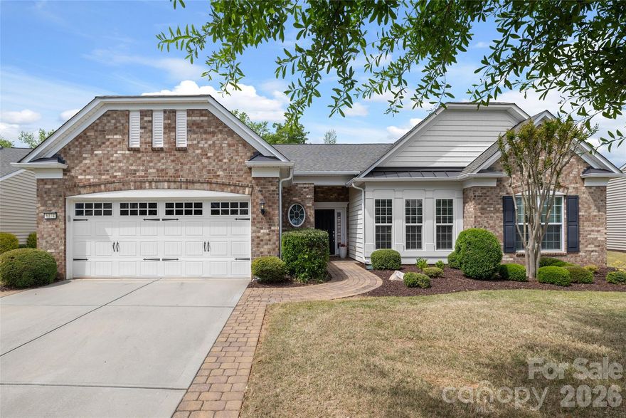 Welcome to this beautiful Crestwood Meadow home in Sun City Carolina Lakes, where thoughtful design and inviting spaces come together effortlessly.

A paver driveway extension leads to a charming walkway and covered front entry, setting the tone for what awaits inside. Just off the foyer, elegant double doors open into a private home office or study - perfect for remote work or a quiet retreat.

As you continue down the front hallway, you’ll find two generously sized secondary bedrooms with access to a full hall bath, offering comfort and privacy for overnight guests. The home then opens into a spacious, open-concept living area designed with both everyday living and entertaining in mind. The great room is anchored by a striking wall of built-in shelving with accent lighting, creating a warm and polished focal point.

A formal dining area with a chandelier provides the perfect setting for gatherings, while the adjacent kitchen and sunroom truly shine. A wall of windows fills the sunroom with natural light, creating a bright and cheerful space to relax. The kitchen features an island with seating, gas range, tile backsplash, stainless steel appliances, and a cozy breakfast nook - each space offering lovely views of the backyard.

Tucked away at the rear of the home, the spacious primary suite offers a peaceful retreat. The ensuite bath includes a walk-in shower with glass enclosure and a dual sink vanity.

One of the home’s standout features is the screened porch, complete with a cathedral ceiling, expansive tile flooring, and dual ceiling fans. This inviting outdoor space is perfect for enjoying warm spring days in comfort and privacy. Just beyond, a custom patio provides additional room to soak up the sun or host gatherings with ease.

Living here also means access to the exceptional, resort-style amenities of Sun City Carolina Lakes, including golf, indoor and outdoor pools, tennis and pickleball courts, scenic walking trails, water access, and more - offering a lifestyle as impressive as the home itself.
