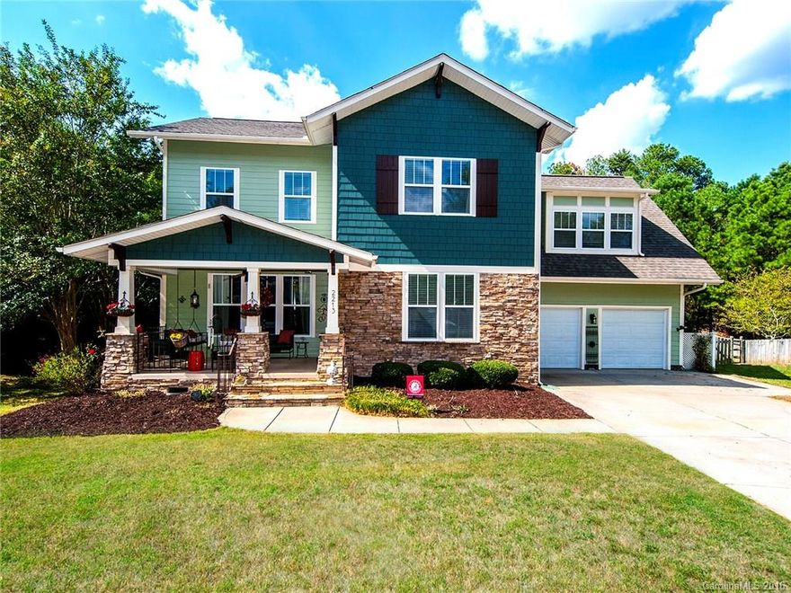 Beautiful craftsman's style home nestled in a cul de sac. Oversized front porch. Hardwoods throughout first floor,  and newer designer carpet upstairs. Amazing cook's kitchen complete with granite, stainless appliances and an upgraded gas stove. Tons of natural light streams in through the new windows! Master down. Private wooded back yard with back deck and a custom pergola for the ultimate in outdoor living. Within walking distance to Tega Cay Elementary, the pool, parks and walking trails.