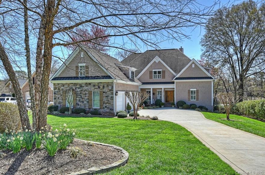 WATERFRONT on LAKE NORMAN priced BELOW tax value! Relax on your covered deck overlooking a beautiful view on this large WF lot! Walk up to your new home & be greeted by rocking chairs on the front porch - very inviting and charming. As you enter the home, there is a view to the water and an absolutely fantastic floor plan. Feels like you are on vacation year round with its great outdoor space including covered porch,patio w/ fire pit & your own sandy beach! Covered dock. LIKE NEW-Spacious rooms!