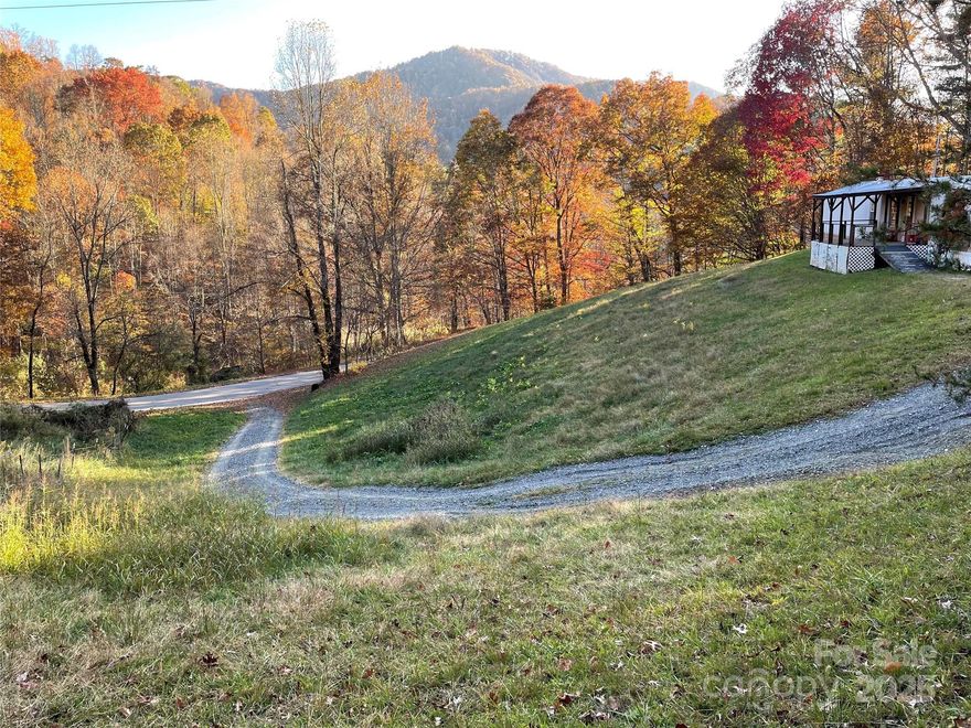 Massive Price Improvement on an already-affordable and adorable home! This is literally the most-affordable home in Marshall--and it's lovey and MOVE-IN READY! Hard-to-find, comfortable and cozy single wide on a private sunny acre with views! This three bedroom, two full bath home has room for everyone. Come enjoy the huge covered deck for dinner al fresco under the stars! Gather around a fire pit in the back yard for a private getaway (you could even install a hot tub--it's that private)! Create and delight in your own SEPARATE WORKSHOP with permanent work tables and electric. Such an easy lifestyle! Living small never felt so large! Come see it soon!