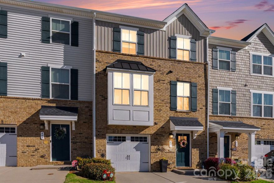 Welcome to this beautifully upgraded 3-bedroom townhome in the sought-after Grantham Place community in Fort Mill, SC, where style and convenience come together. The bright, open-concept main level features luxury vinyl plank flooring, neutral tones, and abundant natural light. The spacious living area flows into the dining space and an upgraded kitchen with granite countertops, stainless steel appliances, a tile backsplash, gas cooktop oven and enhanced cabinetry—perfect for everyday living and entertaining. Upstairs, the primary suite offers a private retreat with a walk-in closet and an en-suite bath featuring dual vanities and a sleek walk-in shower. Two additional bedrooms provide flexible space for guests, a home office, or more, along with a well-designed secondary full bathroom. The home also includes two convenient half bathrooms for added functionality. The lower level adds valuable living space with a versatile family room, ideal for a media room, playroom, or workout area. Enjoy your private patio, perfect for relaxing or entertaining. Located in the top-rated Fort Mill School District with easy access to shopping, dining, and major highways, this move-in-ready home offers comfort, style, and everyday convenience. Don’t miss this opportunity to own a standout home in Grantham Place.