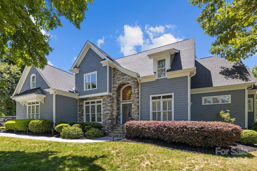 Welcome to this stunning indoor/outdoor entertaining paradise in The Point with a Pool AND Deeded Boat Slip (w/new lift) a short walk away.Boasting NUMEROUS updates, this move-in ready SMART home features a bright gourmet eat-in kitchen w/high-end appliances (Wolf & Subzero) connected to the pool patio, a cozy gas fireplace in the spacious great room, &  lovely glass wine cellar. The luxurious renovated main level owner’s suite offers a freestanding bathtub & glass-enclosed shower, while a tankless water heater ensures endless hot water. A powder room, office, dining area w/butler's pantry & pet friendly laundry room round out the main floor. Upstairs, find 3 bedrooms (1 w/ensuite), full bath, bonus rooms (office & gym), & 2 walk-in attics for storage not to mention an upstairs laundry area too. Outside, the low-maintenance deck leads to a level lawn, oversized patio, & freeform pool with waterfall, tanning ledge, fire pit, landscape lighting, & child safety fence.Your paradise awaits!