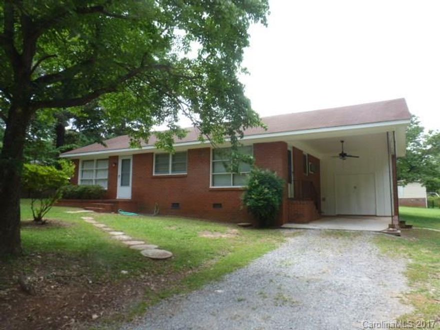 Neat 2BR, 1BA home in the Buford school district. Living room with hardwood floors, dining room, updated kitchen, stove and refrigerator remain, also has breakfast bar. All brick, single attached carport, and fenced yard.