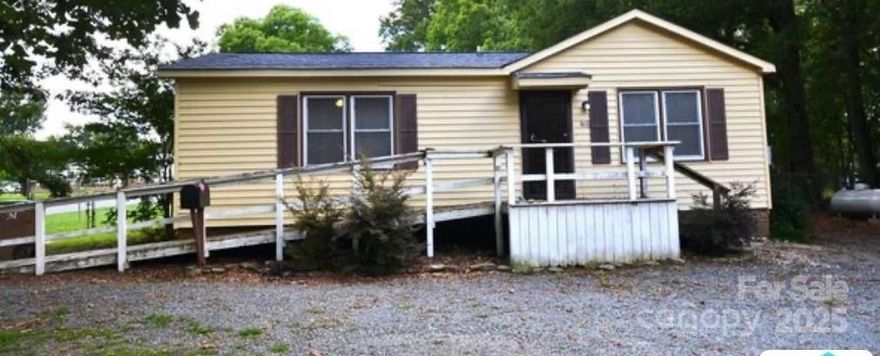 PRICE CORRECTION ALERT!!! Motivated Sellers. Endless potential for this Fixer Upper. Great location. 

Home is located on a desirable corner lot located in downtown Marshville. Conveniently located near shopping and dining. Also close to By-Pass for easy travel. Open kitchen and dining area. Home has large bedrooms with a Jack and Jill style bathroom. Several projects started but can be finished to make it your own. Prefect opportunity to make it your dream home or investment property. Second bathroom, located in laundry utility room. Back yard is fenced in with chain link fence. Shed located in back yard for extra storage. Deck with partial covering located on side going out to back yard. The uncovered part of the side deck has some soft spots and broken boards. Deck and ramp to the main entrance. New roof put on in 2024. New kitchen sink and plumbing updated 2024. Owners are licensed agents.