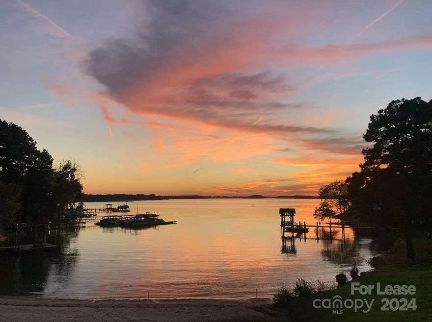 IT DOESN'T GET BETTER THAN THIS! Waterfront, fully furnished condo with LONG RANGE SUNSET views of Lake Norman! This 2BR, 2Bath unit has been fully renovated, and features an open layout. Every room has been thoughtfully designed to maximize comfort and style, ensuring you can move in and start enjoying lake life right away. Each room includes a full walk-in closest as well as an additional coat storage. Exclusive to Half Moon Bay, your own private beachfront is a stones throw away, where you can relax on the sand or dive into various water activities. Private tennis/pickleball courts and a community pool are also exclusively available to our Half Moon Bay residents. This unit is centrally located to the best dining, shopping, and events Lake Norman has to offer. Birkdale golf course is just a 5min drive away and Charlotte airport is only 20min away! Owner pays for water, gas and internet. Tenant covers the electricity. No smoking. Small dogs allowed (up to 30lbs).