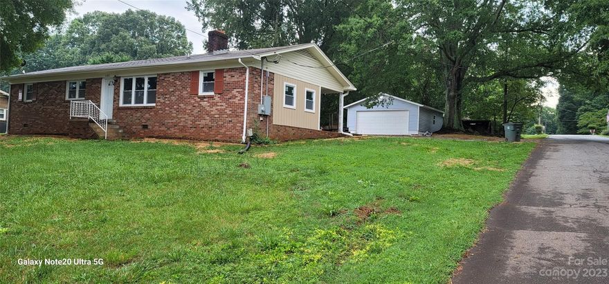 Great Location ! Great neighborhood !!! solid brick house on a
corner lot. This  house has been fully renovated with many desired features, from new bathrooms, a tankless water heater that saves you money on electricity, bluetooth fans in the bathrooms, video camera outside, to a door lock that you can unlock from anyhwere in the world. Some additional hidden gems in this house in addition to new kitchen with granite countertops and soft close doors and drawers cabinets. New driveway, new windows,   detached 2 car garage and an outbuilding that can be used as a workshop or storage building. Enjoy family cookouts in the backyard with a built in brick firewood stove.