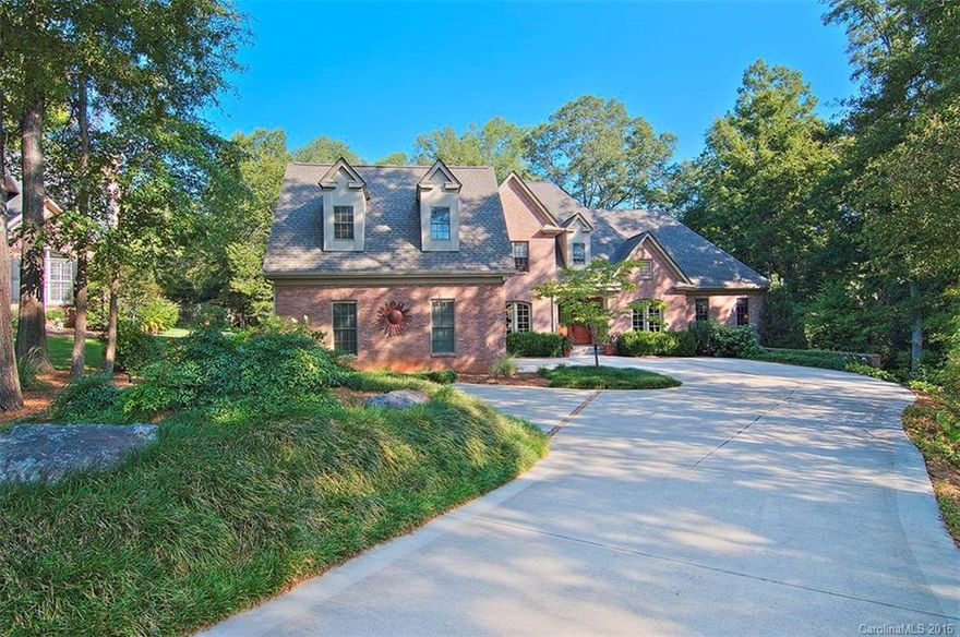 This 5BR/4.5BA YES, the most beautiful custom home inside and out. Quality and taste abound with beautiful cabinetry throughout, hardwood floors, travertine, 10' ceilings, trayed and coffered. Built-ins, sound system, central vac, and high end appliances. Open floor plan with master down. Wonderful back porch and patio with summer kitchen for entertaining. Lovely landscaping that includes a rain garden.