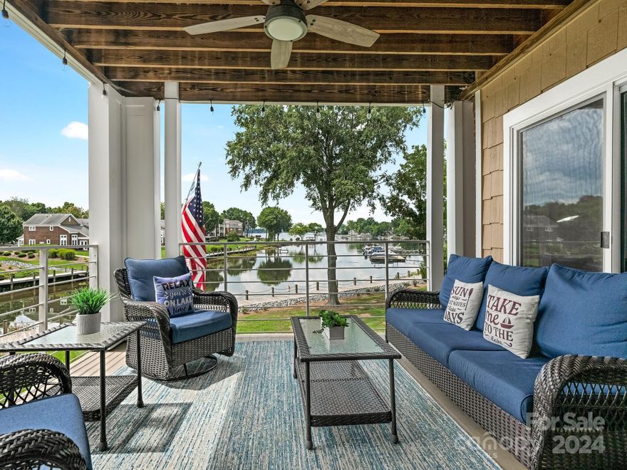 This RENOVATED, FURNISHED, waterfront condo has year-round GORGEOUS, LONG-RANGE views, & ELEVATOR access.  New price reflects the condo only.  Inquire with the listing agent for the additional price of the GARAGE & BOAT SLIP.  Discuss w/accountant the phenomenal TAX ADVANTAGE if this is your second home, by generating short term rental income and deductions i.e.  VRBO, corporate relocation, & seasonal income. This condo has a 9 year 5 star rating that will be turned over to new owner.  The seller has taken great care of this property, upgrading kitchen and baths, replacing the HVAC (2019), hickory floors (3/4” hand scraped), striking granite counter tops/ backsplash, and a stone fireplace with an elegant live edge walnut mantle. Located minutes to Birkdale Village, Robbins Park, Ramsey Creek Beach, restaurants and shops make for relaxed living at its best.  Outdoor enthusiasts will appreciate easy access to Cornelius' Emerald Necklace greenway, and the Lake Norman's lakeside boardwalk.