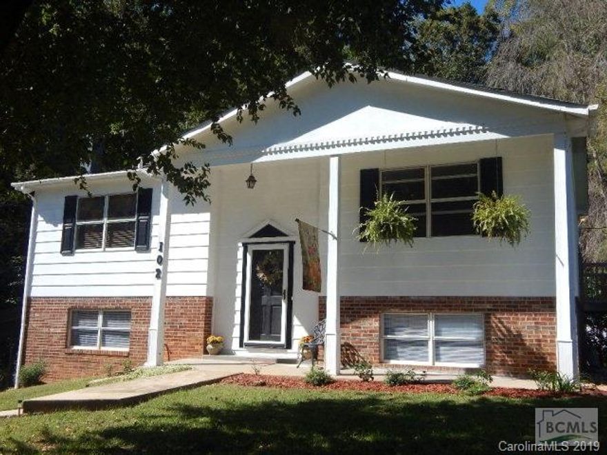 Impressive 3BR/1.5BA home's Exterior and Interior completely updated and refreshed.Nestled on a large level lot at the end of a quiet Cul-de-sac neighborhood. Home greets you with an open foyer and easy flow floorplan from the living room with a gas fireplace into the kitchen with an inviting deck off the dining area. An abundance of natural light flows throughtout the home. Appreciate the newly installed Mohawk Laminate Wood flooring, No Carpet around, decorator wall colors, Curtains and detailed fixtures. Three generous bedrooms each with own spacious closet and nicely finished full bathroom. Finished full basement will continue to impress you with an enormous amount of usable space for whatever your family needs. Remodeled half bath could easily be a full, huge 11x10 Laundry room, Wood stove atop a brick hearth, two separate walk out basement doors to an entertaining private back yard patio. Creek bordering the back of the property. Large DBL Detached Carport and Outbuilding. One Ye