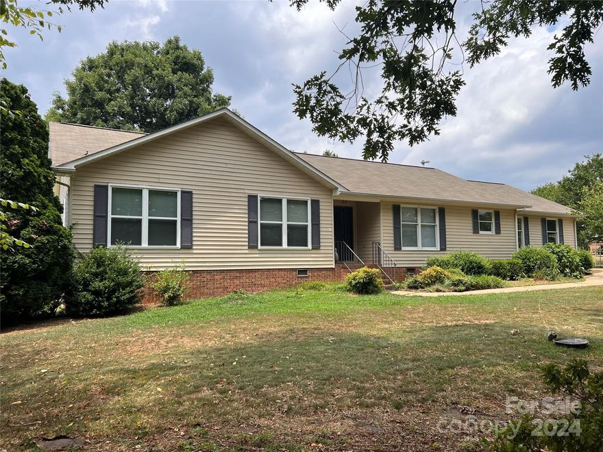 Nestled on a quiet street in Boiling Springs, this beautiful home boasts 3 bedrooms and 2 bathrooms. The inviting interior features hardwood floors, formal dining room and a vaulted living room, providing a spacious and airy feel. The primary bathroom features a jetted tub and walk in shower and includes a walk-in closet. Don't miss the custom concrete counter tops in the kitchen. Enjoy relaxing on the enclosed rear porch or working on projects in the large detached workshop/shed. This home offers comfort, convenience, and charm in a serene setting.