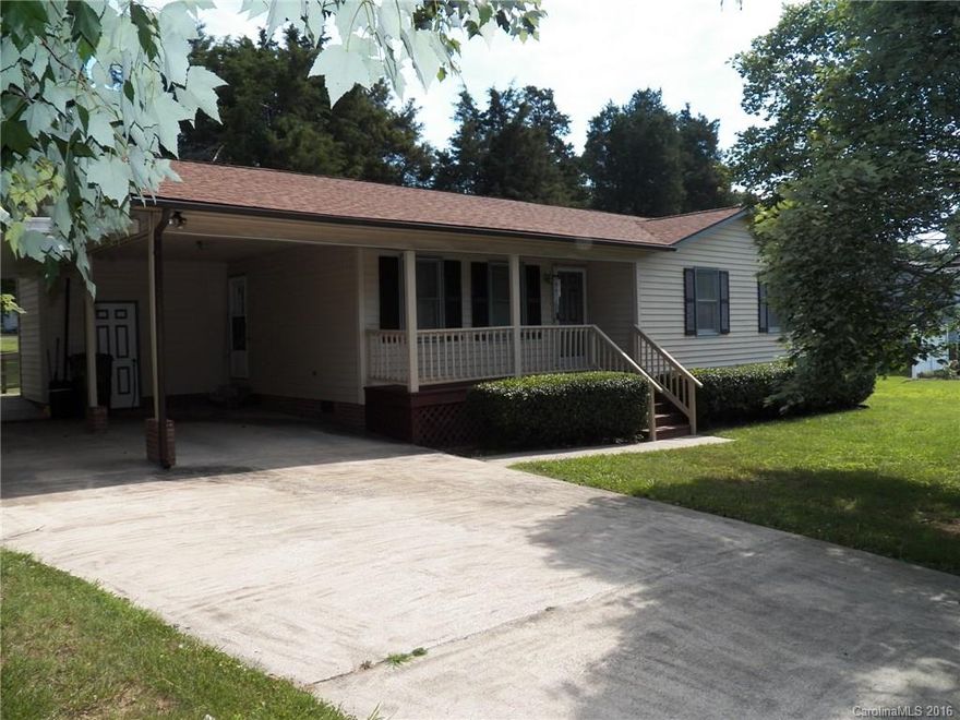 1188 sq ft, 3BD/2A ranch, spacious living room with laminate flooring, large master suite and roomy secondary bedrooms, corner lot, attached double carport, front porch, deck, private level back yard, mature trees, convenient to shopping & dining, MOVE-IN READY!