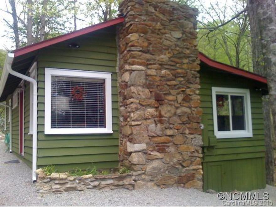 Unbelievable Creek with waterfalls!!! This is the perfect Mountain cottage in the very desirable Walker in the hills area. Furnishings can be purchased separate. Great level parking. Sit on the back deck and enjoy the cascading creek. Minutes to Downtown Waynesville or Sylva. EM to Buyers Attorney.