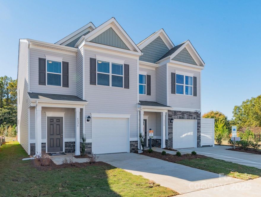 Welcome to The Suwanee floorplan at Hickory Glen! This low-maintenance, two-story townhome is just 10 minutes from Uptown Charlotte and offers 1,629 sq ft with 3 bedrooms and 2.5 bathrooms. Step inside to an open-concept main level featuring a modern kitchen with 36" cabinets, granite countertops, a large island, stainless steel appliances, and a generous pantry. The kitchen flows seamlessly into the dining area and spacious family room—perfect for everyday living or entertaining. Durable vinyl plank flooring runs throughout the first floor.

Upstairs, the primary suite features a walk-in closet and an en-suite bath with double marble vanities and a large, tiled shower. The primary bedroom also has a tray ceiling to elevate the space. Two additional bedrooms, a full hall bath, and a convenient laundry room complete the upper level.  Blinds are included throughout. Located in the Hickory Glen community, which offers just 46 townhomes—with only two units per building—every home is a desirable end unit!