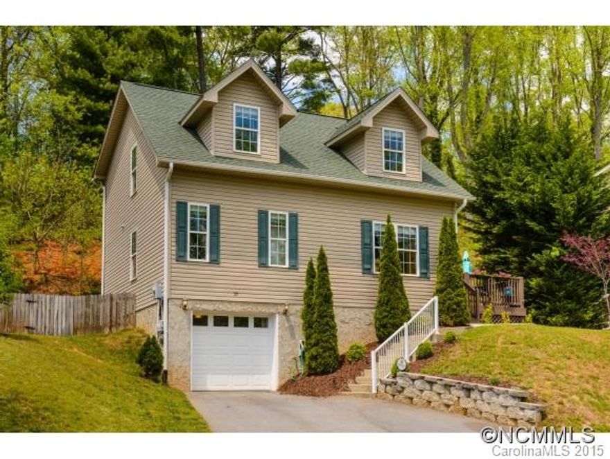 Move right in! Feature packed, affordable newer construction in a convenient W Asheville location. Fully fenced back yard with retaining wall, side deck with pasture views for your morning coffee. Master on the main and two large bedrooms upstairs. New granite kitchen counters, large pantry, security system, and crown molding. W/D hookups on the main as well as lower level. Bsmt has storage, finished room w/sound, and is plumbed for a third bath.