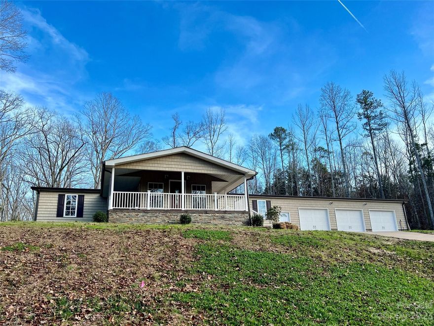 Beautifully renovated-3413 Cedar Circle Rd will not disappoint! A perfect opportunity has arrived in N. Lancaster just mins from Indian Land, SC! Embrace privacy & seclusion on this expansive 6.95-acre property. Enjoy the tranquility of the surrounding trees, nature, & tons of wildlife. USDA, FHA, VA & SC Housing eligible. A meandering driveway leads you to this stunning residence featuring 3 bedrooms and 2 full baths, showcasing a semi-open floor plan. The interior exudes warmth & hospitality from the moment you enter. A spacious covered front porch extends a gracious welcome, while a luminous sunroom invites you to enjoy the outdoors from the inside comfort. Primary suite w/gorgeous ensuite, free standing tub, oversize tile shower and huge custom closet. Spend quality moments w/family & friends as you unwind in the rear sunroom equipped w/a grill & beverage center, or opt for a cozy gathering around the firepit on the expansive cobblestone patio. Shhh, don't forget the hidaway room!