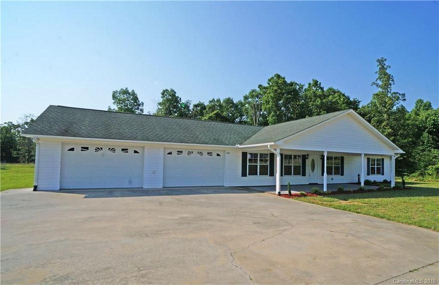 Move right in! The whole house has had a facelift: completely repainted (including garage and porch), new flooring throughout (laminate, tile in the bathrooms, and carpet in the bedrooms), new lighting and plumbing fixtures, new countertops, new appliances, and new landscaping! Truly oversized 2 car garage! Level lot out back and 5 acres to wander. Great location, minutes from 1-40. Huge living room in the front of the house & even bigger family room in the back. Concrete patio to entertain on!