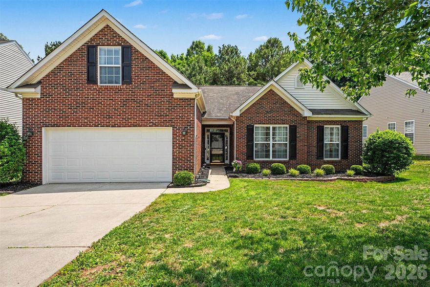 NEW ROOF JUST INSTALLED!!! 3146 Pine Bluff Way is a beautifully maintained, move-in-ready single-family home in Indian Land's desirable Legacy Park community. Offering a highly functional 1-story layout with a versatile Bonus/Bedroom upstairs. This property features 4 bedrooms, 2 full bathrooms, and 2,028 square feet of bright living space. Enjoy the convenience of true main-level living on an open, spacious floor plan. The heart of the home is an open-concept great room highlighted by a cozy natural gas fireplace. Perfect for hosting, the formal dining room is accented with elegant wainscoting trim. The kitchen features classic wood cabinetry, tile flooring, an eat-in breakfast area, and great visibility into the main living spaces. The primary bedroom suite serves as a peaceful retreat, boasting a separate sitting room, tray ceiling and a private bath with a dual-sink vanity, soaking tub, and separate walk-in shower. Two additional bedrooms, a second full bath, and the laundry room are also conveniently located on the main floor. The second floor features a private 215-square-foot 4th bedroom or bonus room. This flexible space is perfect for a quiet home office, media room, gym, or guest suite. The exterior showcases great curb appeal with a partial brick front and low-maintenance vinyl siding. Situated on a flat, level lot, the property includes a concrete driveway and an attached 2-car garage providing 466 square feet of parking and storage. Relax or entertain on the covered back patio overlooking the backyard. Legacy Park offers a fantastic lineup of neighborhood amenities, including a scenic community pond with a fountain, a swimming pool, outdoor tennis courts, a playground, and a basketball court. Located in Lancaster County this home offers the benefit of low county taxes and is zoned for the highly-regarded Indian Land school district (Indian Land Elementary, Middle, and High School). Owner is a licensed agent.