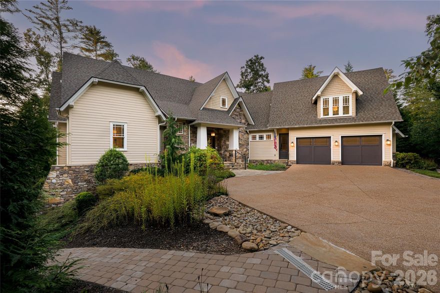 A refined expression of transitional design, this residence blends timeless craftsmanship with modern livability, set against a serene wooded backdrop. An open, light-filled floor plan creates an atmosphere that is sophisticated and inviting, with expansive windows framing protected community land that ensures privacy and a peaceful connection to nature. At the heart of the home, the living room offers a seamless indoor-outdoor dialogue, ideal for quiet moments and gracious entertaining. The gourmet kitchen is equally compelling, appointed with top-tier appliances, custom cabinetry, generous countertops and a spacious walk-in pantry, complemented by a convenient laundry room. A screened-in porch extends the living space year-round, overlooking the tranquil forest and inviting relaxation in every season. A private suite above the two-car garage, complete with a full bath and separate staircase, provides exceptional flexibility for guests, a home office or creative retreat. The terrace level enhances the lifestyle further with a large exercise room suited for wellness or recreation. Ownership includes access to The Ramble’s celebrated amenities such as miles of scenic trails, a wellness center, saline pool, tennis and pickleball courts, and lush parks. An exceptional offering where elegance, ease and natural beauty converge.