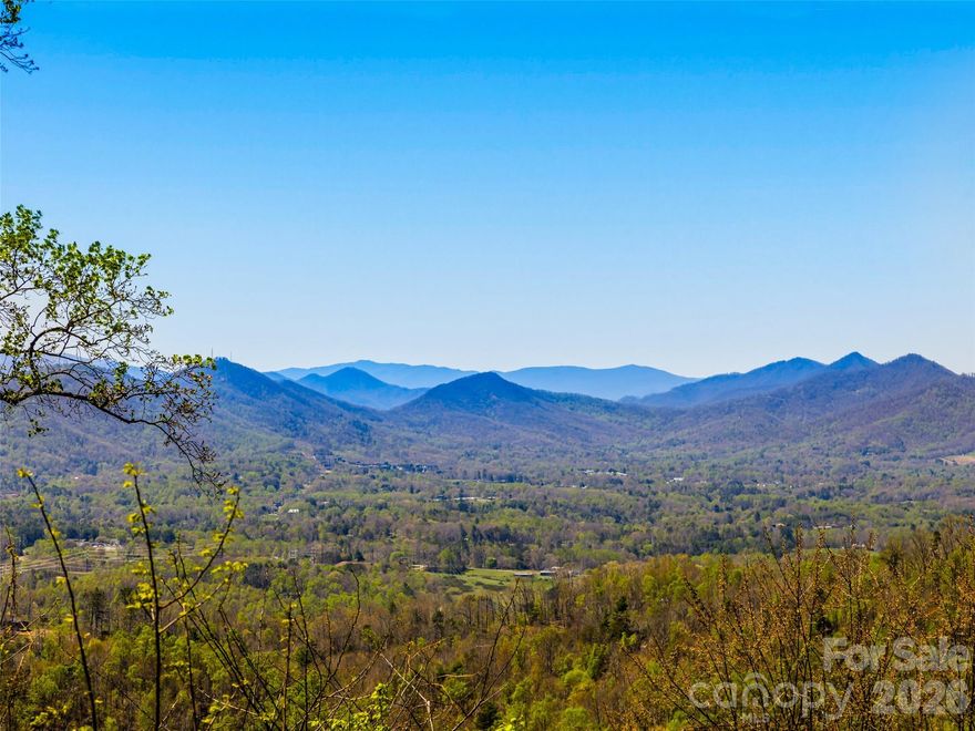 Dreaming of golden sunsets and spectacular year-round panoramic views? When the mountains call, look no further than this approximately one-acre home site in the gated community of Serenity, conveniently located just a few minutes north of Asheville and one of only a few remaining lots in the area with jaw-dropping views. Imagine your life in the mountains: traversing the Blue Ridge Parkway, enjoying breweries and wineries, the Biltmore, the arts scene, and famous Asheville restaurants. All while enjoying the million-dollar view from your own custom home! Most utilities are in place, the road is paved, and a topographical survey and geotechnical analysis of the lot are available. Visit today!