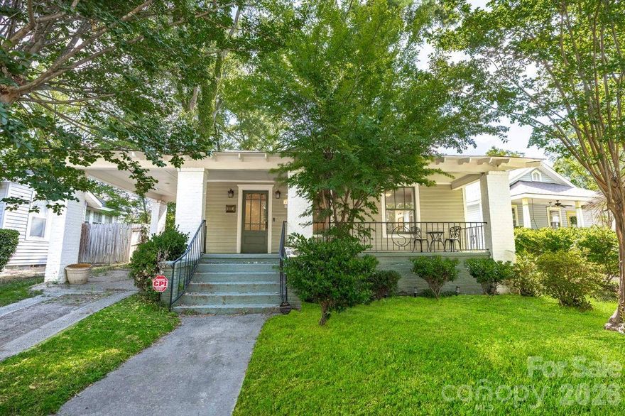 Beautifully restored Historic Elmwood Park bungalow, fully renovated in 2021 with all new plumbing, electrical, and HVAC. Thoughtfully updated with historic preservation in mind, this home seamlessly blends timeless charm with modern conveniences. Features include heart pine floors throughout most of the home, a stunning designer kitchen with high-end appliances, stylish hardware, and exceptional lighting. Spacious primary suite offers a private bath and walk-in closet. Two additional bedrooms share a beautifully updated bath with dual vanities and a tiled shower, plus a convenient half bath for guests. The second bedroom also includes a large walk-in closet. Enjoy outdoor living on the inviting covered front porch or in the fully fenced backyard with a new privacy fence—perfect for relaxing or entertaining.