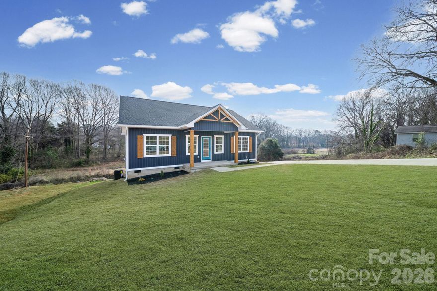 This beautiful custom home is ready for its first owners and you won't want to miss these finishes. Tucked away and located in the Fuse district, which is located just a short distance from the CaroMont Health Park. This home features: An open Floorplan, Vaulted Ceilings in the living room and Kitchen, 9 foot ceilings throughout the home, Quartz countertops, 72" Island with soft-close custom cabinetry, SS appliances, SS Farm sink, DUAL Shower heads in the Tiled Primary bathroom walk-in shower, Large walk-in closet in the Primary bedroom, Spacious Pantry area, Covered front porch, NO HOA, Bermuda SOD installed in the front and on the sides, Crawl space with plenty of storage, Cedar posts and shutters, Covered front porch and so much more... Don't miss the opportunity to own this gem....