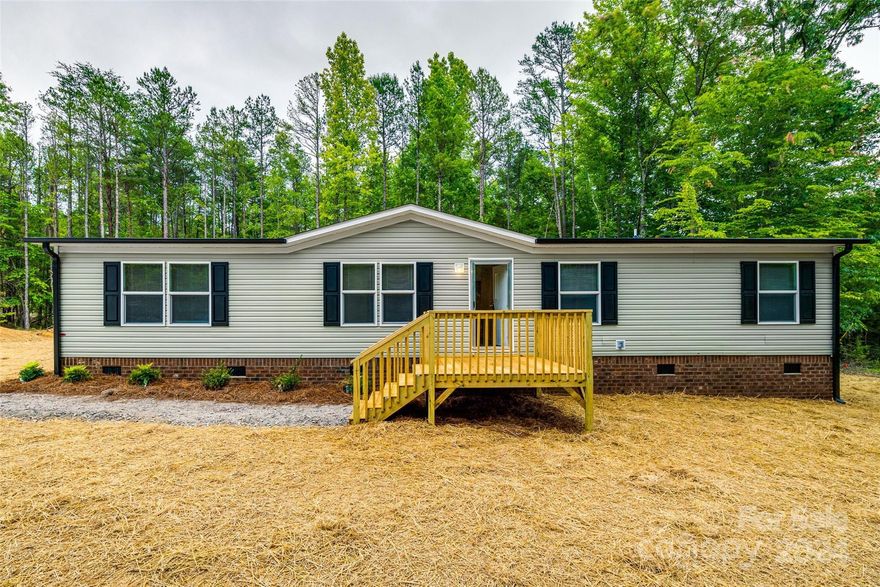 Welcome to 2493 Orchard Rd, Smyrna, SC! Nestled on a picturesque 5-acre lot, this brand new manufactured home offers a perfect blend of comfort and tranquility. Boasting 4 spacious bedrooms and 2 bathrooms, this home is designed for relaxed living. Enjoy your morning coffee or evening relaxation on the charming deck overlooking your expansive property. With ample space for gardening, outdoor activities, and future projects, this is country living at its finest. Don’t miss the opportunity to own this beautiful home in a serene, rural setting!