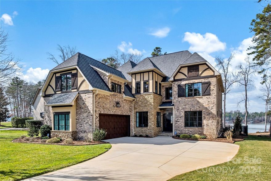 Located in the prestigious Reflection Pointe community, this 5 bedroom, 4/2 bath home is a harmonious blend of luxury, comfort & timeless elegance. Nestled on a sunset view, FLAT waterfront lot, this home offers sanctuary for those seeking tranquility & modern living. Approaching the meticulously landscaped yard, one will be greeted by the charm of the brick, stone & stucco home. Natural light cascades through large windows, illuminating the hardwood floors that flow seamlessly throughout the main level.The heart of the home is the gourmet kitchen, stainless steel appliances, marble counters & a spacious island, perfect for a culinary enthusiast & entertaining. Open-concept living boasts a cozy fireplace & offers a transition to the backyard oasis pool area. Primary BR on main, 2 laundry rooms, Generac generator, new hardwoods upstairs, tankless water heater, epoxy floor in garage & cabinets & covered dock are just some of the many upgrades (under attachments). Please watch drone video