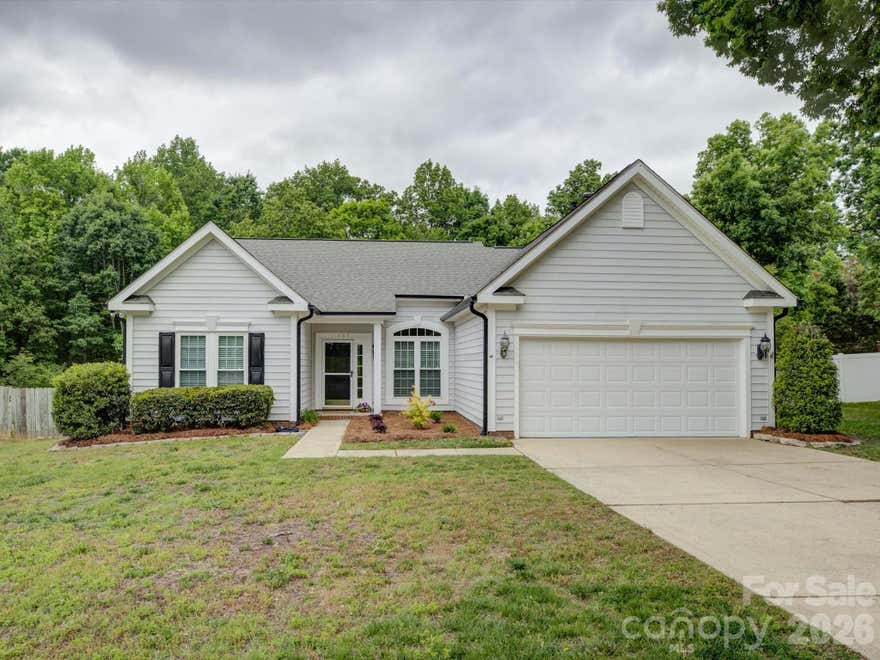 Awesome, turn-key single story home in sought-after Whitegrove neighborhood! Top rated Fort Mill schools, of course! Welcome to this move-in ready, completely updated home in a lovely community with sidewalks, mature trees, trails, and more! Absolutely gorgeous home with tall ceilings, en trend finishes and lighting! Easy to maintain vinyl plank flooring throughout - no carpet! Spacious living and dining areas with a split bedroom plan perfect for privacy. Light, bright and open with large windows. You will love the screened in porch as well as the extended deck with the view of trees in the professionally landscaped, fully fenced backyard (approx .3 acre!). Bonus features include a replaced tankless water heater and updated plumbing, blinds throughout, washer/dryer, soft close kitchen cabinets, and a storage shed! This home is truly a must see!