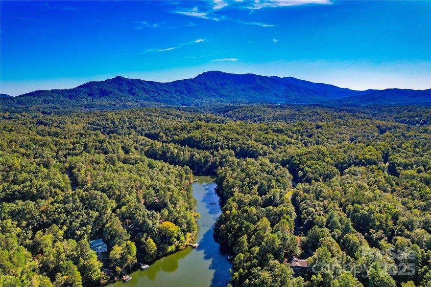 Waterfront 1.7 acre homesite with 214 feet on shoreline on Lake Adger situated in the foothills of the Blue Ridge Mountains. Experience the perfect blend of natural beauty and refined living in the prestigious Lake Adger community. This stunning property includes a deeded dock permit, granting future owners the opportunity to enjoy direct lake access and tranquil waterfront views from their own private dock. Gentle sloping and unique topography surrounded by mature hardwoods, the homesite offers a peaceful, private setting ideal for your custom-built retreat. Lake Adger is a private mountain lake community renowned for its spectacular panoramic mountain vistas, 3250 acres+/-  carefully planned, 13+ miles of equestrian and hiking trails, private marina, and scenic picnic area with several golf courses near by. Designed to preserve the area’s natural beauty and wildlife while providing modern comforts, Lake Adger offers a lifestyle of serenity and sophistication. Conveniently located near Hendersonville, Asheville, Lake Lure/ Chimney Rock, NC, Greenville/ Spartanburg, SC and Tryon International Equestrian Center. An exceptional opportunity to design your custom lakefront residence, surrounded by the unmatched scenery and serenity of North Carolina’s mountain lakes.