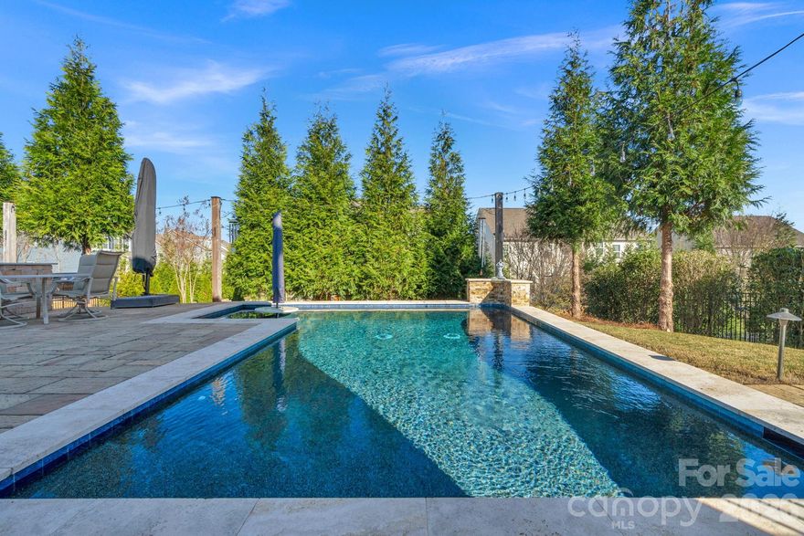 Looking for the perfect blend of backyard paradise and resort-style community living in highly sought-after Millbridge. This beautifully landscaped home welcomes you with fresh exterior paint and a charming front porch.   Your be welcomed as you enter the foyer. You will love the ten foot ceilings and curved archways that lead you to the formal dinning room or the nice sized family room with gas fireplace. Custom walk in pantry with wine/beverage refrigerator and butcher block countertop. Butler pantry which is great for entertaining. Gourmet kitchen with white cabinets/gas cooktop and a large island that overlooks the family room. Guest bedroom downstairs with access to a full bath. Finished two car garage with epoxy coated floors and 50 amp outlet. Whole house water filtration system is conveying. Finished storage under the stairs has many purposes. Upstairs you have spacious primary bedroom with new floors, custom solid wood birch closet system in primary closet. Three secondary bedrooms and a large bonus or fifth bedroom. Laundry room is pre plumbed for a utility sink. Enjoy the three year old heated salt water gunite pool with built in table and umbrella. Outdoor kitchen with grill/refrigerator and prep area. Fig tree that produces in the summer. Enclosed TV in backyard conveys and completes this entertainer delight. Residents of Millbridge enjoy resort style amenities including a grand clubhouse with coffee bar, movie room, and party space; multiple pools with a lazy river; sports courts; fitness facilities; scenic walking trails; and award-winning schools. All with low Union County taxes and convenient access to the best of South Charlotte. Check out the interactive 3D video.